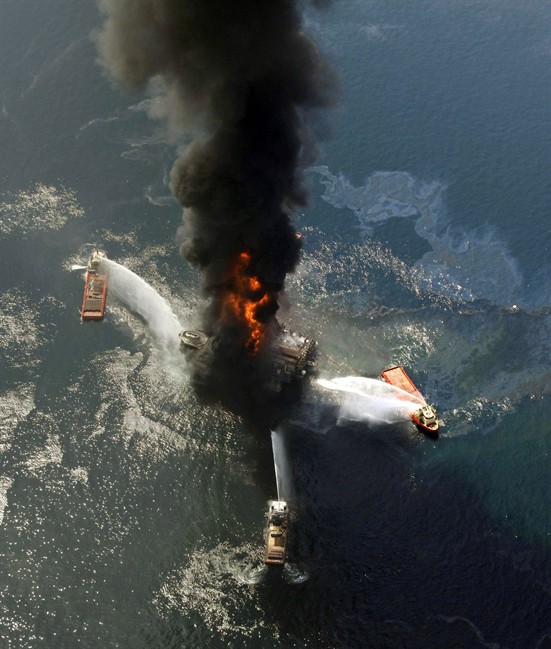 In an April 21, 2010 file photo, the Deepwater Horizon oil rig burns after a deadly explosion in the Gulf of Mexico. 