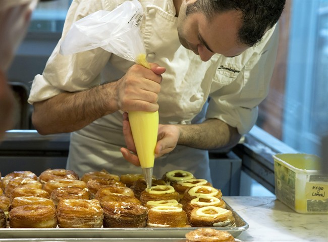 Chef Dominique Ansel makes Cronuts, a croissant-donut hybrid, at the Dominique Ansel Bakery in New York on June 3, 2013.