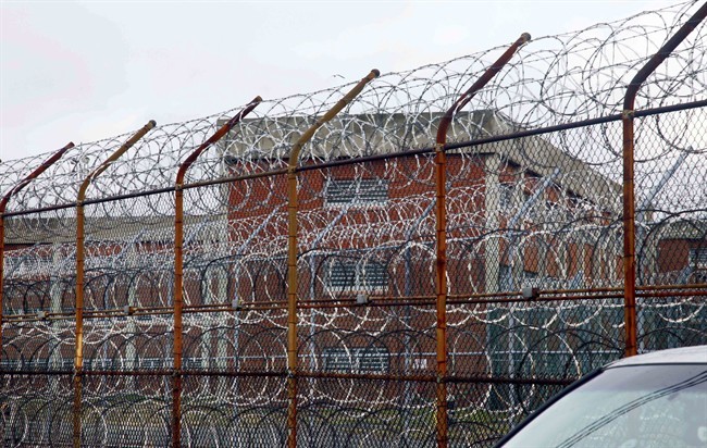 In this March 16, 2011, file photo, a security fence surrounds the inmate housing on New York's Rikers Island correctional facility in New York.
