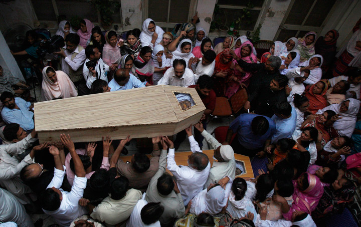 Pakistani's mourn the death of their family members killed from a suicide attack on a church in Peshawar, Pakistan, Tuesday, Sept. 24, 2013. Pakistani Christians denounced the deadliest attack ever in this country against members of their faith when a pair of suicide bombers blew themselves up amid hundreds of worshippers outside a historic church in northwestern Pakistan on Sunday, Sept. 22, 2013. 