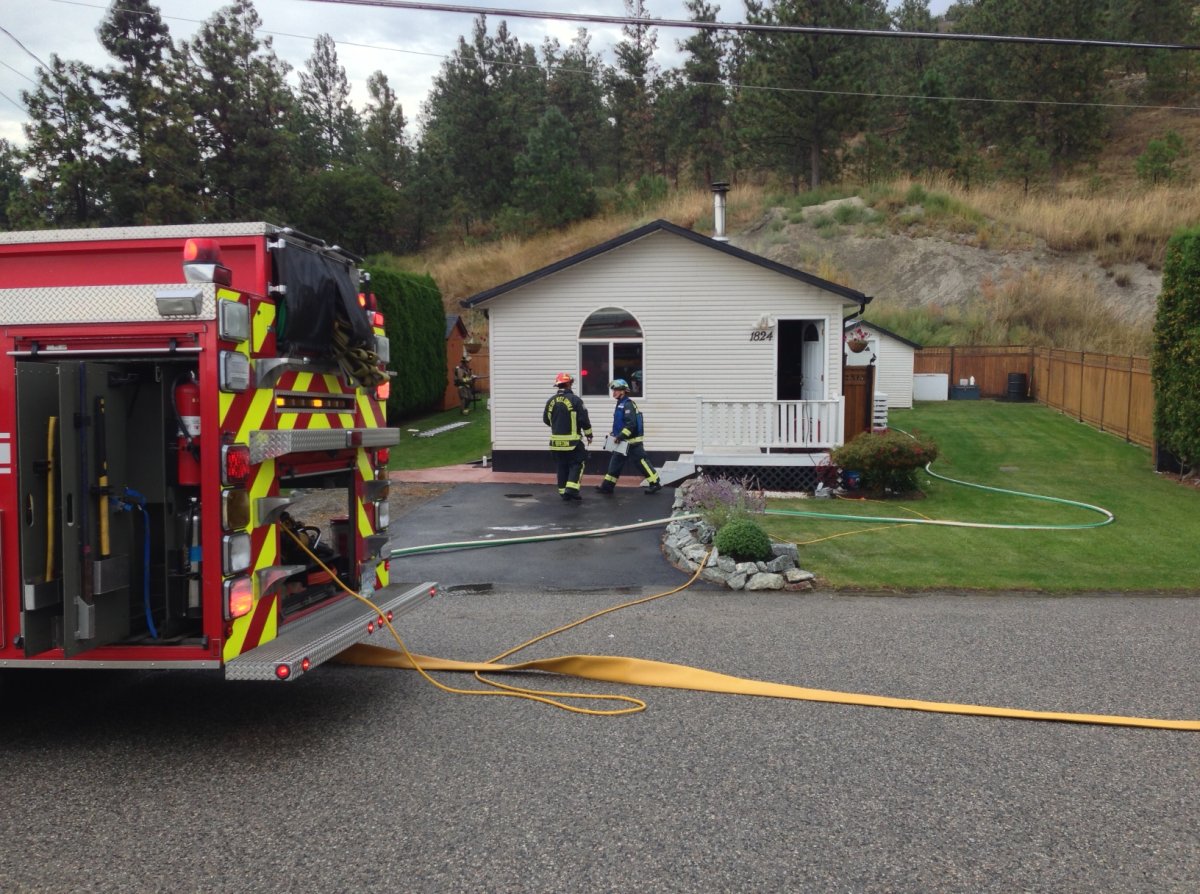 Neighbours tell Global Okanagan that thick black smoke was pouring out of the home and flames were visible inside.
