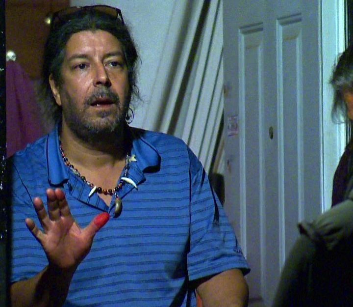 Andreas Pirelli speaks to police from his Parkdale apartment.