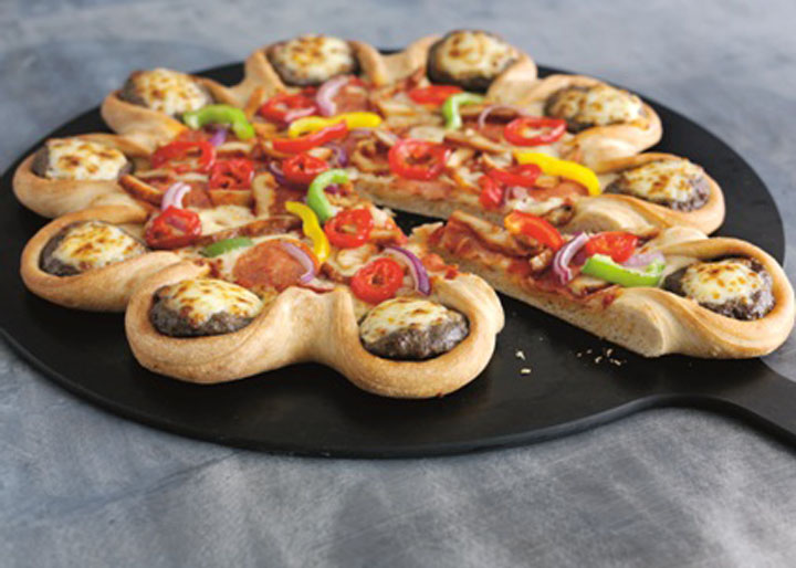 After roaring success in the Middle East, the pizza chain’s almost 3,000-calorie cheeseburger crust pizza launched across the United Kingdom this week. And it isn’t making health officials happy.