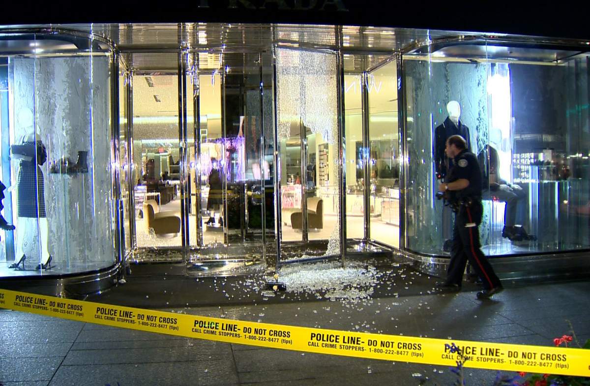 The front door glass of a Prada store on Bloor Street is smashed during a robbery on Sept. 18, 2013.