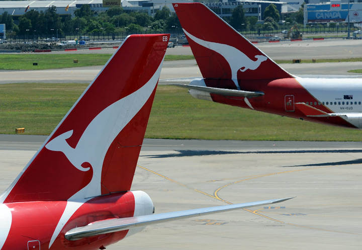 Two Qantas Boeing 747s cross paths at Sydney International Airport on November 15, 2011.