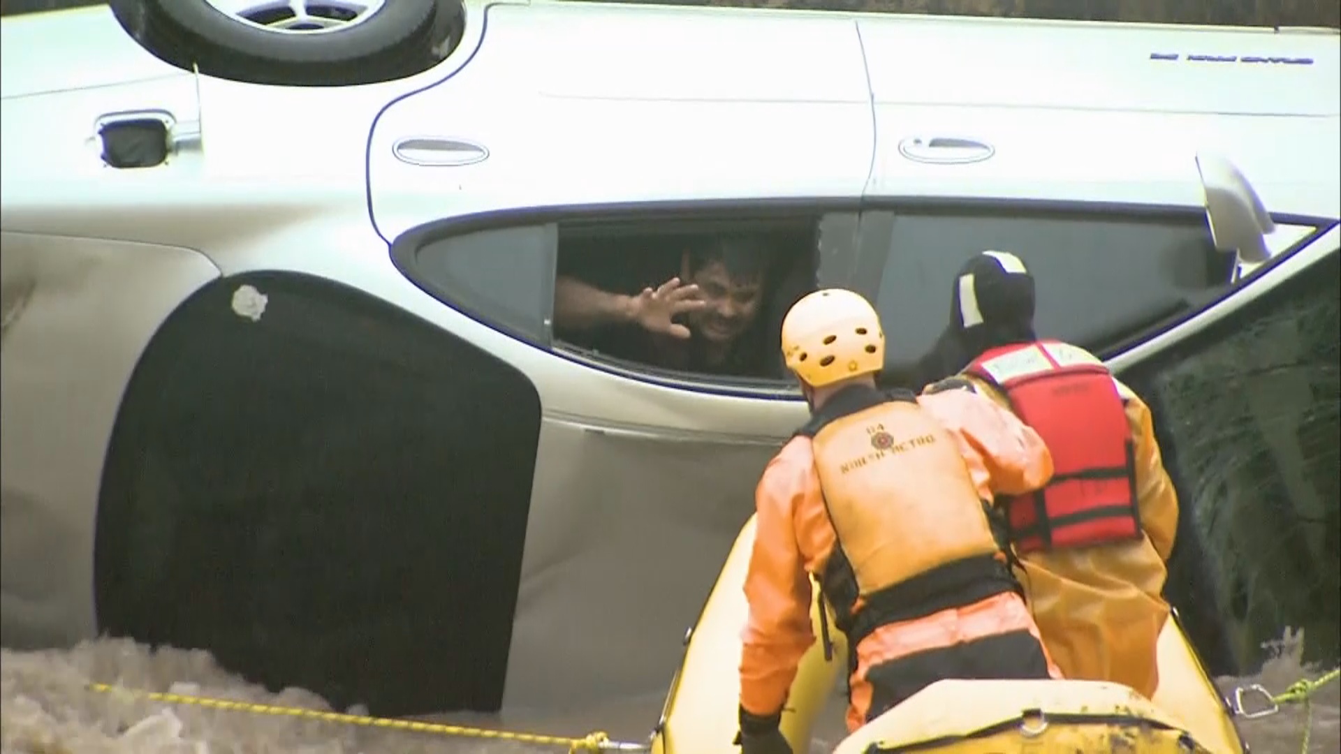 Watch Dramatic Rescue Of Man Trapped By Rising Flood Waters Near