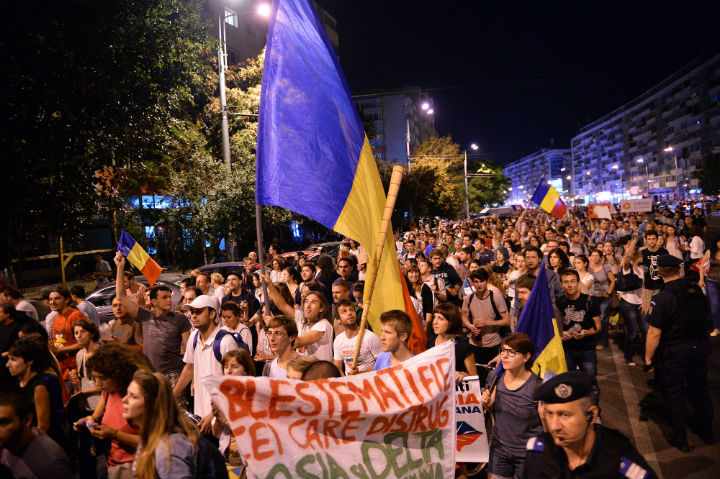 Protesters march during the eight day of demonstrations in Bucharest against the Rosia Montana Gold Corporation (RMGC), a Canadian gold mine project using cyanide, on September 8, 2013. 