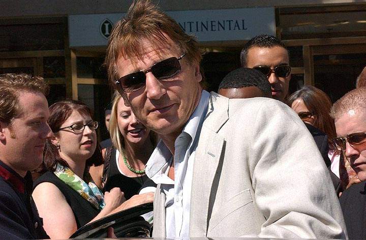 Liam Neeson is mobbed outside the Intercontinental Hotel on Bloor Street. (John R. Kennedy / Global News)