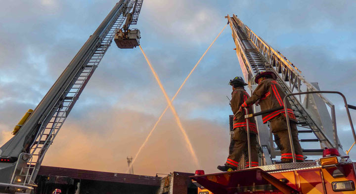 Beautiful photo of Toronto firefighters at the scene of an overnight blaze.
