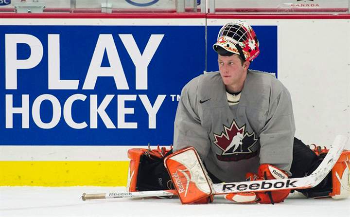 Goalie Tyler Bunz stretches during Canada's annual selection camp in preparation for the IIHF World Junior Championships in 2011. Bunz came to a rude realization in his first season as a professional goaltender. "At this level, guys can shoot the puck no matter what position they play or what role they play," said Bunz.