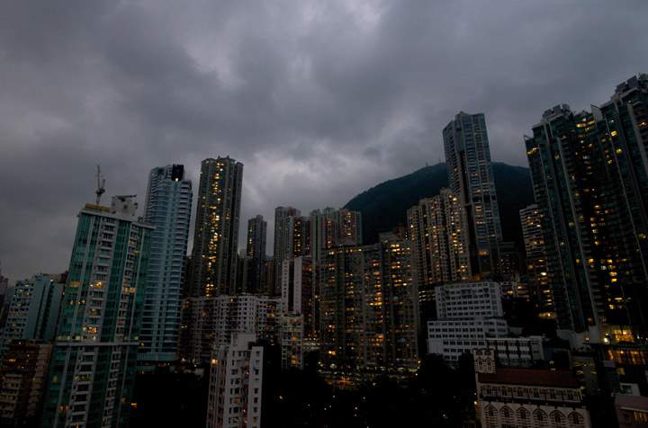 Dark clouds are pictured over the skyline of Hong Kong island as Typhoon Usagi approaches the territory on September 22, 2013. Severe Typhoon Usagi barrelled towards Hong Kong on September 22, shutting down one of the world’s busiest sea ports and throwing flight schedules into disarray from Europe to the United States.   (Photo credit: Getty Images)
