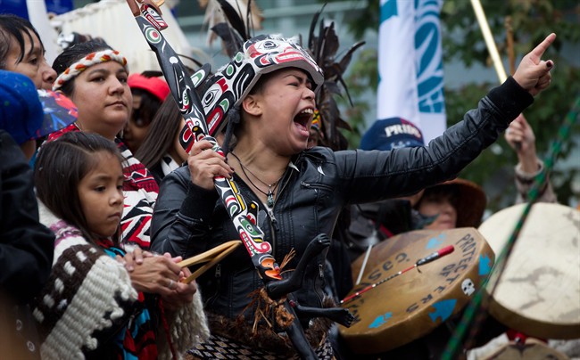 A First Nations woman cheers while taking part in the Walk for Reconciliation in Vancouver, B.C., on Sunday September 22, 2013. Thousands of people attended the walk that wrapped up a week of Truth and Reconciliation Commission of Canada events in the city.
