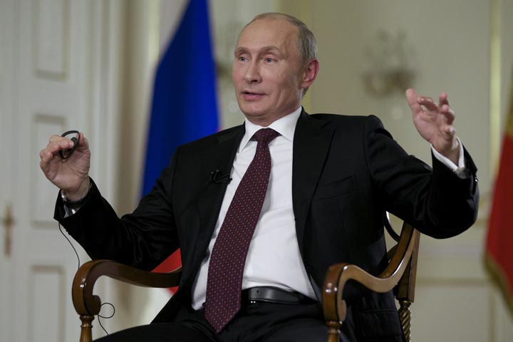 Russian President Vladimir Putin gestures while speaking to John Daniszewski, the Associated Press's Senior Managing Editor for International News,  during an AP interview at Putin's Novo-Ogaryovo residence outside Moscow, Russia, Tuesday, Sept. 3, 2013. 