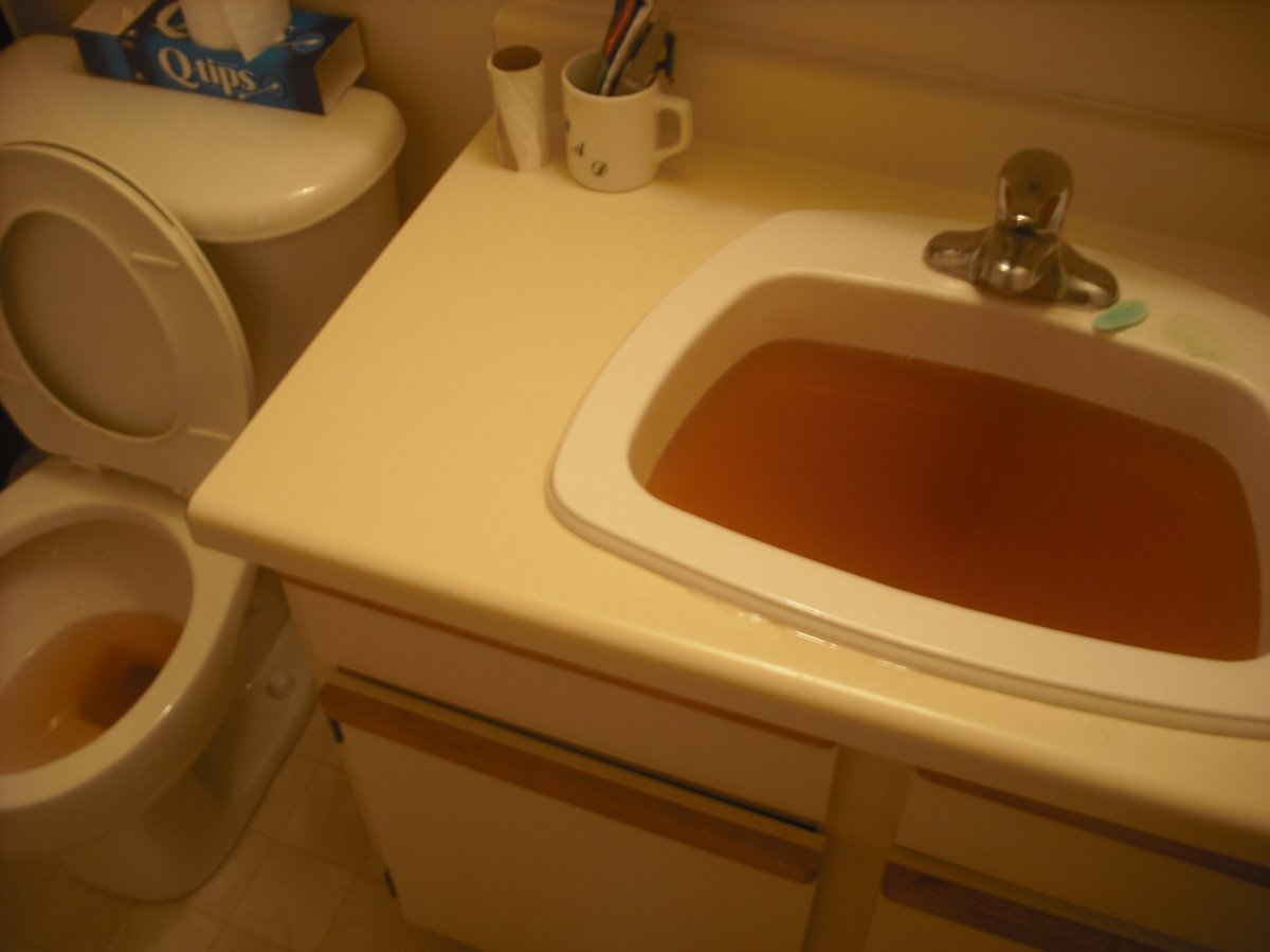 Brad Lillie says he ran all the taps in his home for 40 minutes and the water remained brown on Tuesday, Sept. 24, 2013.