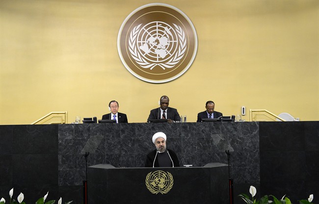 United Nations Secretary-General Ban Ki-moon, left, president of the 68th Session of the United Nations General Assembly John Ashe, center, and Under Secretary-General Tegegnework Gettu, right, are seated above as Iranian President Hassan Rouhani addresses a high-level meeting on Nuclear Disarmament during the 68th United Nations General Assembly on Thursday Sept. 26, 2013 at U.N. headquarters. 