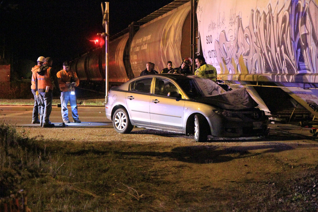A man is in custody after allegedly driving his car into a train on October 12, 2013.
