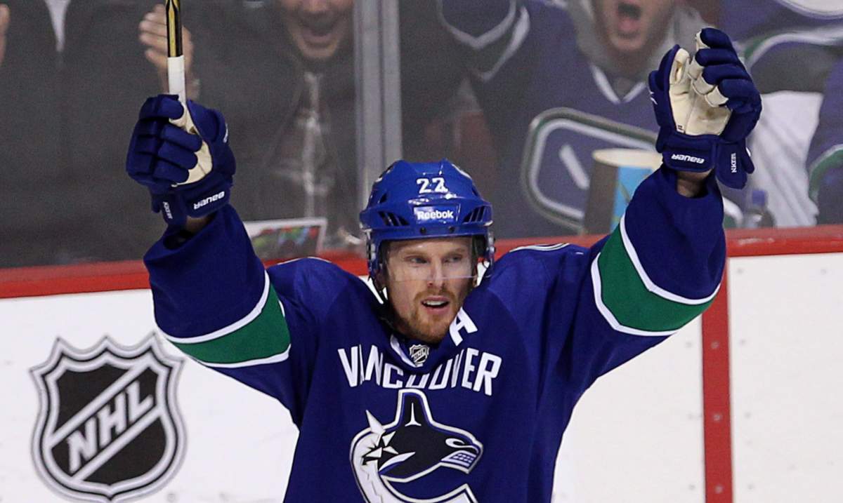 Vancouver Canucks left wing Daniel Sedin (22) celebrates a goal. THE CANADIAN PRESS/Jonathan Hayward.