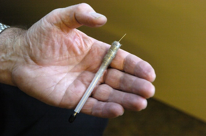 FILE -- Dr. Ford displays a needle made from a Bic pen by prison inmates. He has recently completed a study on safe injection programs in prisons. Photo taken at the Ontario Medical Association. October 27, 2004.
