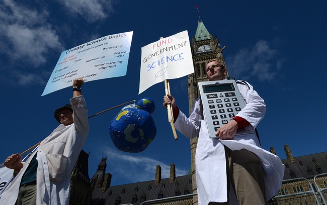 Scientists rally on Parliament Hill in Ottawa on Monday, September 16, 2013 as Canadian scientists and their supporters held demonstrations across the country, calling on the federal government to stop cutting scientific research and muzzling its scientists.