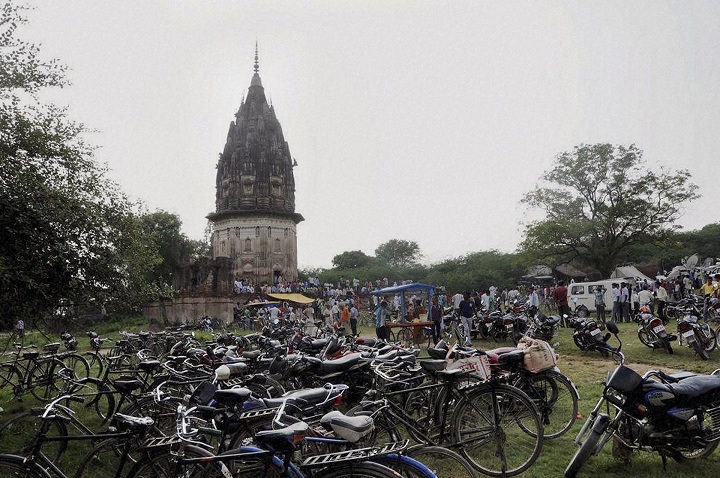 In this Thursday, Oct. 17, 2013 photo, people visit the fort of King Rao Ram Baksh Singh in Unnao in the northern state of Uttar Pradesh state, India. Archaeologists began digging for treasure beneath the 19th century fort on Friday, after a popular Hindu holy man said a former king appeared to him in a dream and told him of the cache.