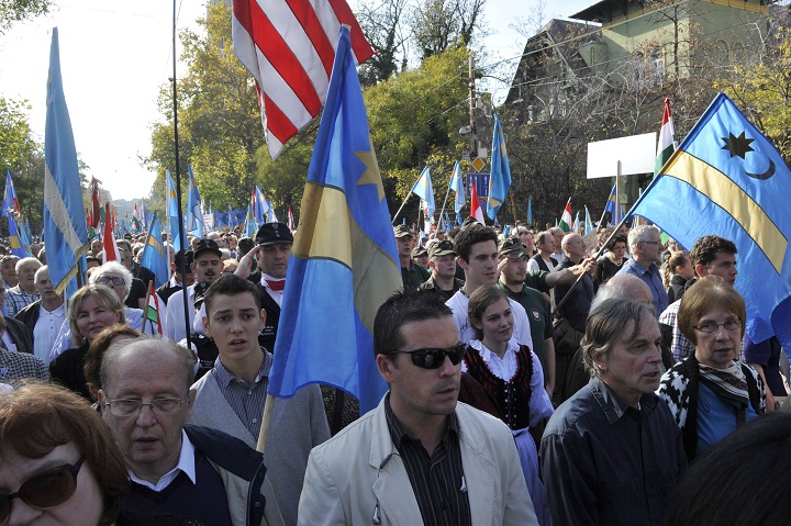 Participants of a march for Szekler autonomy, organized in support of the Great March of the Szeklers in central Romania's Szekler Land, carrying Hungarian and Szekler flags (blue and yellow) in Budapest, Hungary, Sunday, Oct. 27, 2013. Szeklers are ethnic Hungarians living in the eastern part of Transylvania, Romania. The Great March of the Szeklers was organized by the Szekler National Council of Romania on the same day. 