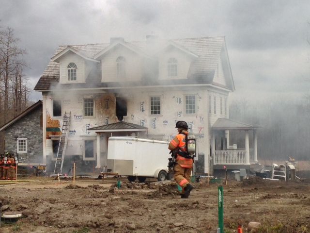 A fast moving fire injures one worker at a home under construction in the area of 52105 Range Road 225 on Oct. 22, 2013.