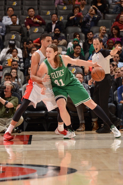  Kelly Olynyk #41 of the Boston Celtics controls the ball against Austin Daye #5 of the Toronto Raptors during the game on October 16, 2013 at the Air Canada Centre in Toronto, Ontario, Canada. 