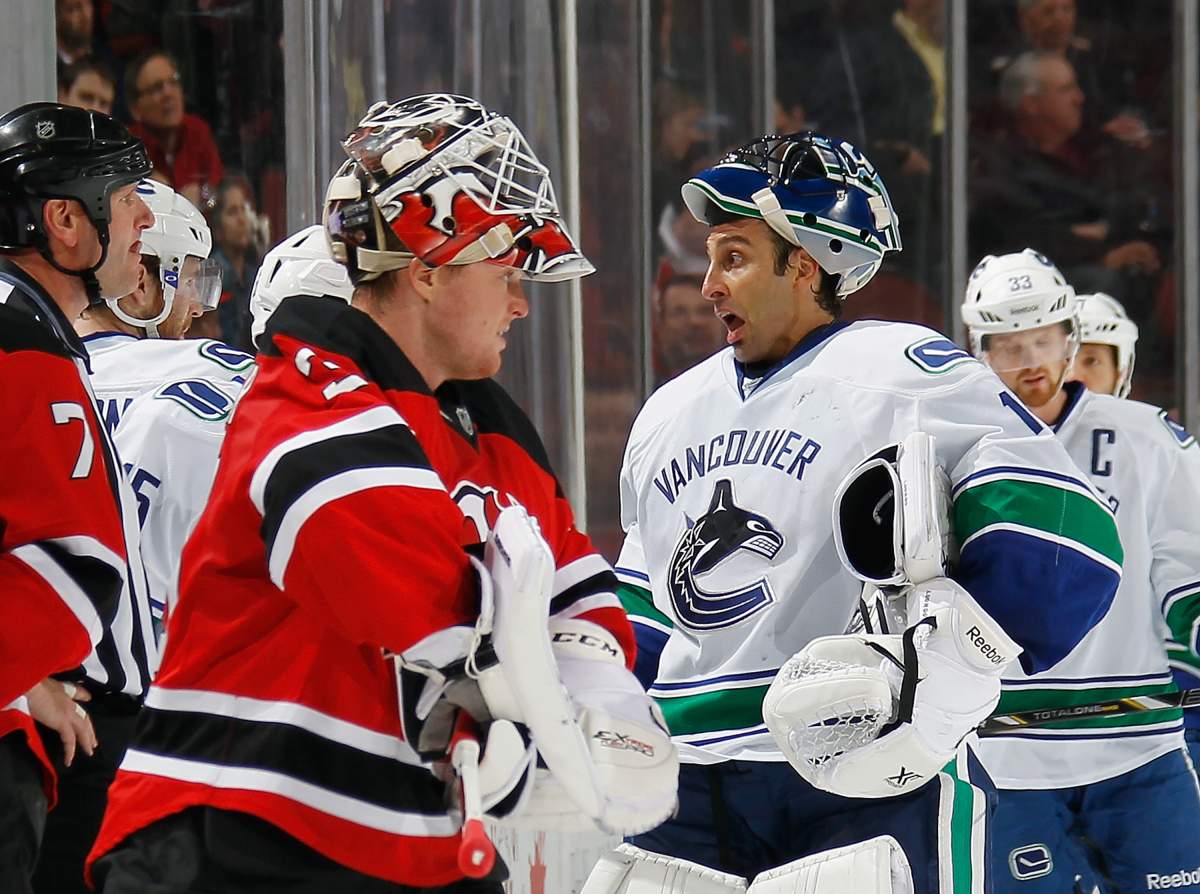 Former teammates Cory Schneider and Roberto Luongo play against each other at the Prudential Center.  (Photo by Bruce Bennett/Getty Images).