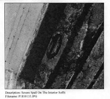 Photo of a hole in the bridge deck from a November 2012 inspection report.