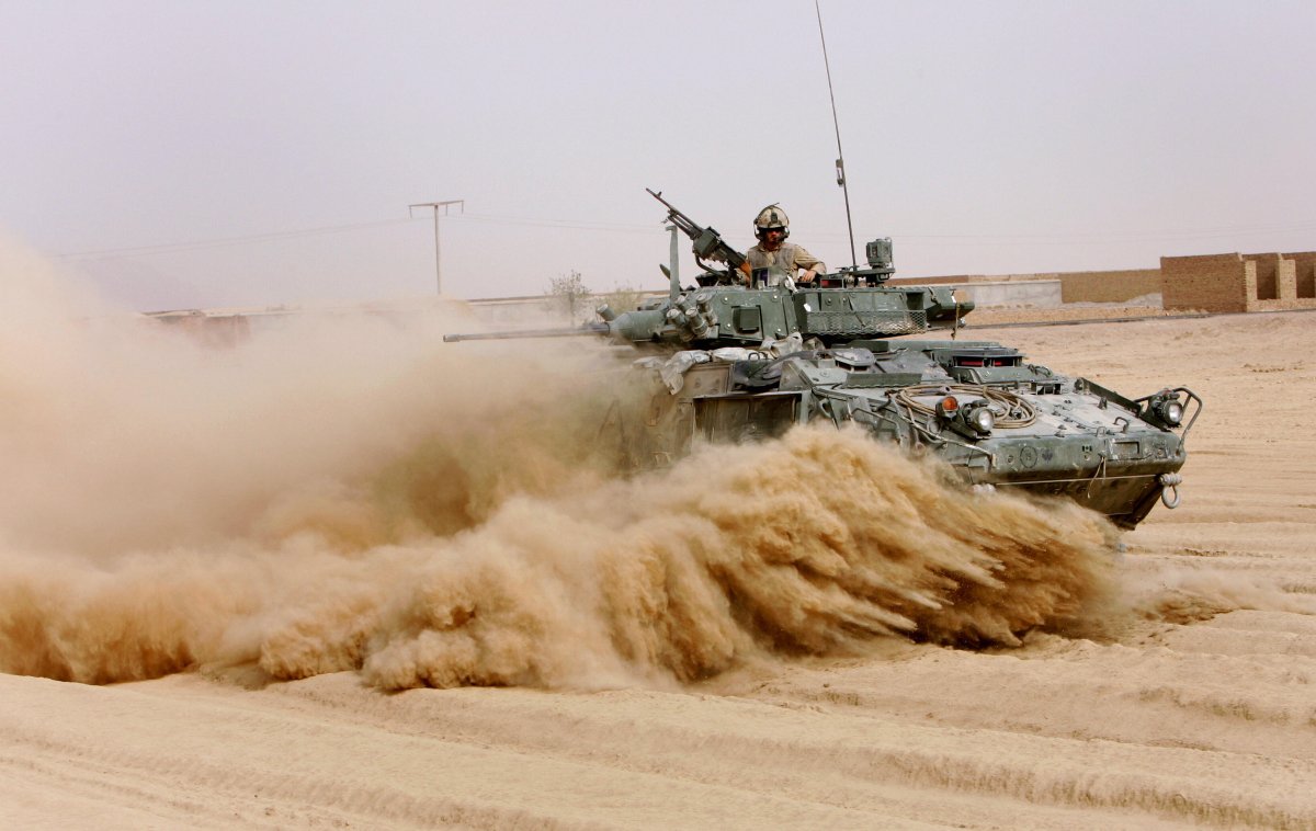 Panjwayi, AFGHANISTAN:  Soldiers from Charles Company, The Royal Canadian Regiment, drive their Light Armoured Vehicle (LAV) through a volatile area in Panjwayi district, Kandahar province, 9 November 2006.