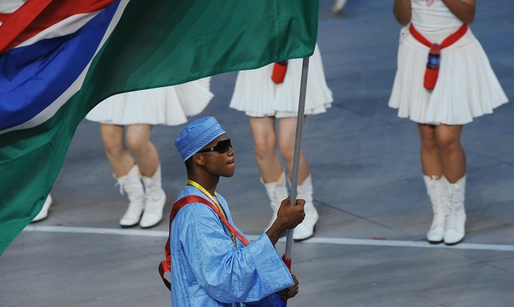 FILE -- Athlete Badou Jack (C) Gambia's flag bearer parades in front of his delegation during the 2008 Beijing Olympic Games opening ceremony on August 8, 2008 at the National Stadium in Beijing.