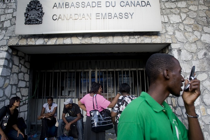 FIle: Haitians wait outside the Canadian Embassy January 20, 2010 in Port-au-Prince, Haiti. 