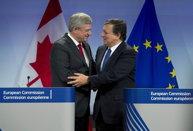 Canadian Prime Minister Stephen Harper and European Commission President Jose Manuel Barroso shake hands following a joint media availability Friday, October 18, 2013 at the European Commission in Brussels, Belgium. THE CANADIAN PRESS/Adrian Wyld.