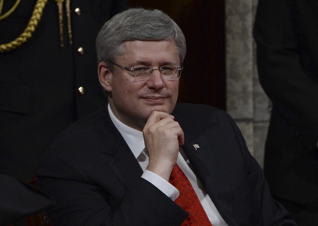 Prime Minister Stephen Harper waits in the Senate for the Speech from the Throne to begin on Parliament Hill in Ottawa, Wednesday Oct. 16, 2013.