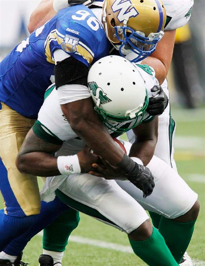 Blue Bomber Alex Hall (96) sacks Roughrider quarterback Darian Durant in Winnipeg on Sept. 8. The Bombers dealt Hall to the playoff-bound Roughriders on Sunday.