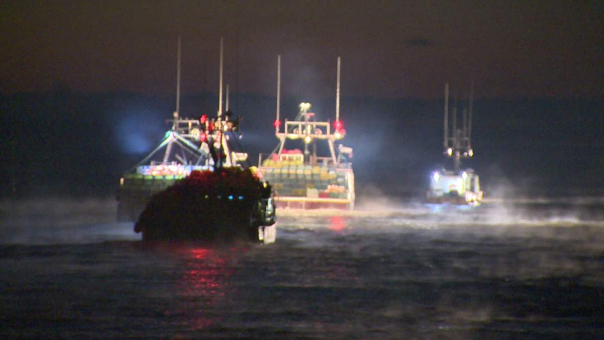 FILE - Lobster fishing boats set out on the first day of the fall lobster season in Alma, N.B.