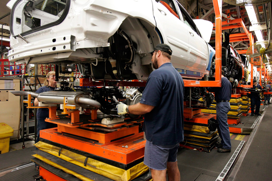 An assembly line worker is pictured at GM's CAMI plant in southwestern Ontario.