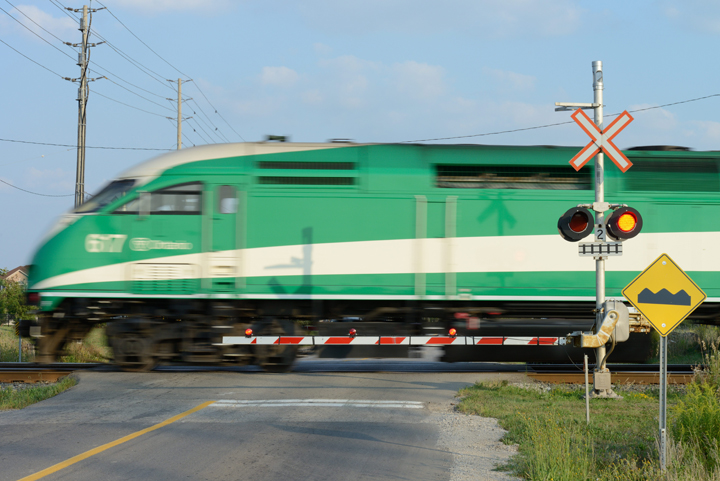 A GO Train passing through a railway crossing, Mississauga, Ont., August 20, 2013.