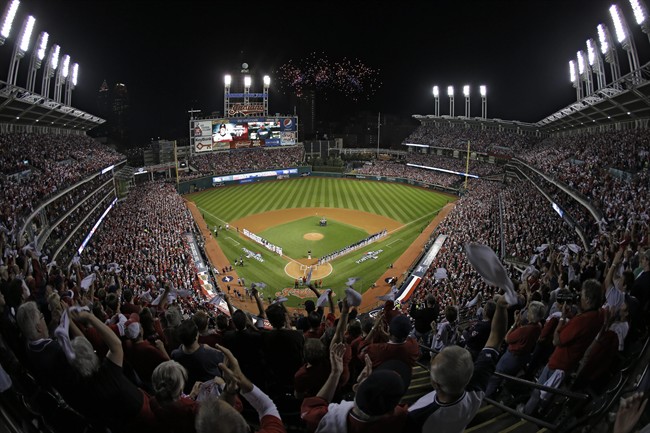 Fans in the upper deck wave towels as the Cleveland Indians and the Tampa Bay Rays are introduced for thew AL wild-card baseball game Wednesday, Oct. 2, 2013, in Cleveland.