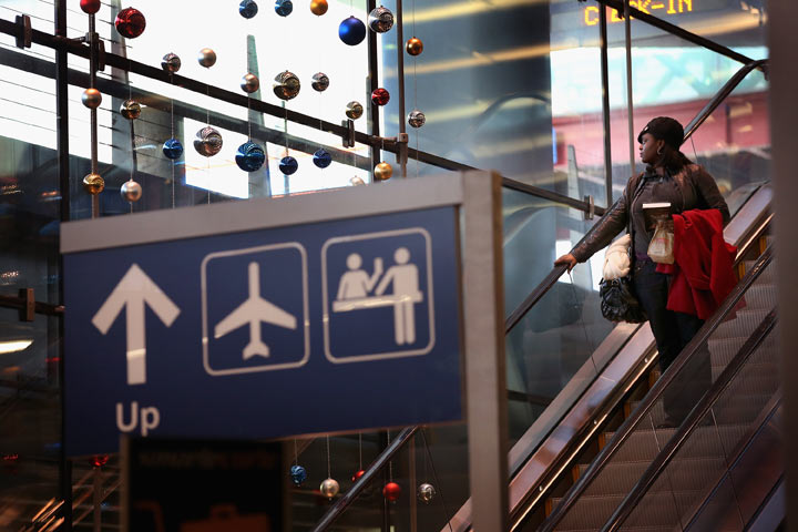 A passenger heads to the baggage claim area of O'Hare International Airport on December 21, 2012 in Chicago, Illinois.