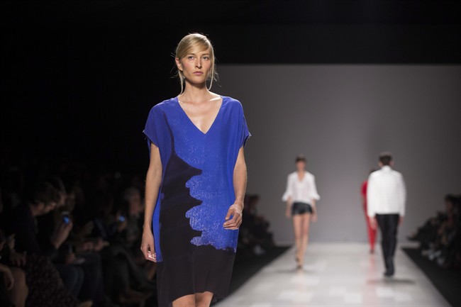 A model shows a creation from Joe Fresh while walking the runway during Toronto Fashion Week in Toronto on Wednesday October 23, 2013. The brand is teaming up with Toronto's Ryerson University to create what is being billed as the country's first fashion innovation centre.