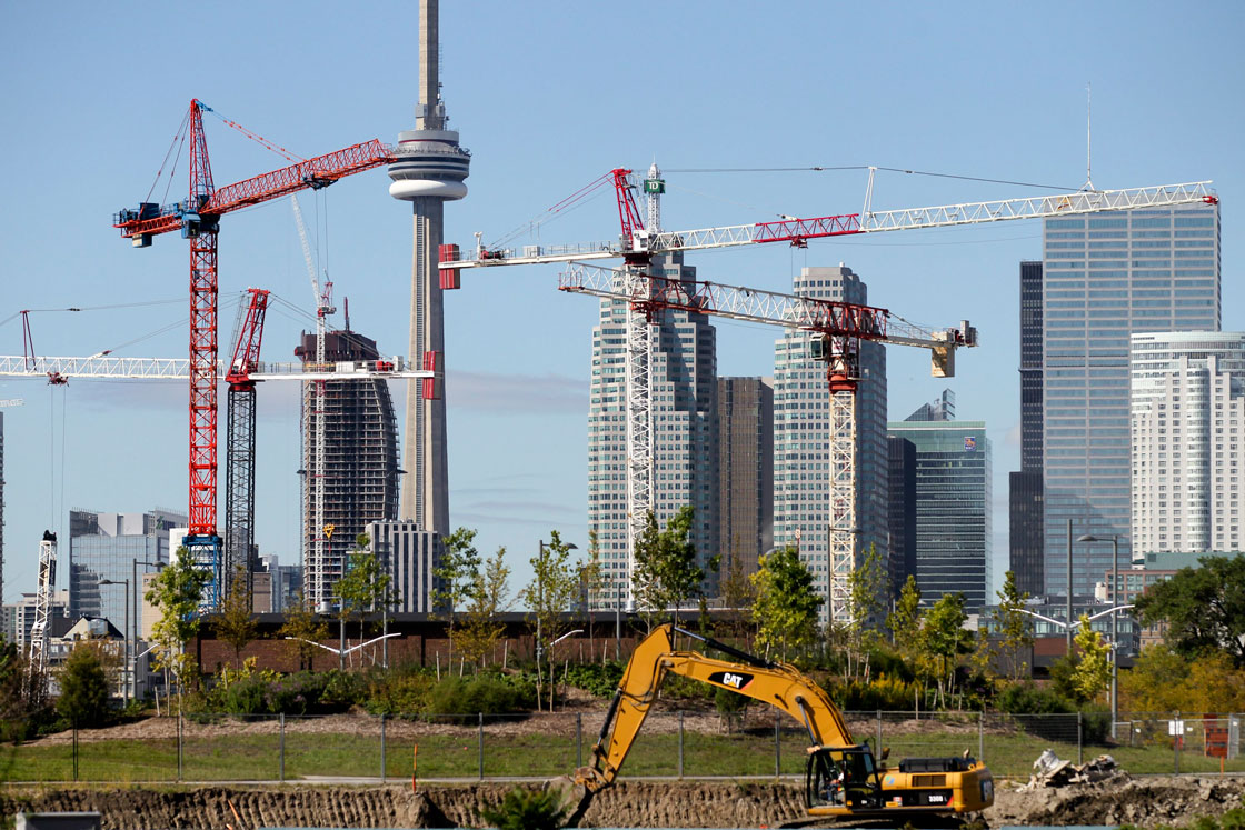 Cranes erecting condos dot Toronto's skyline. 