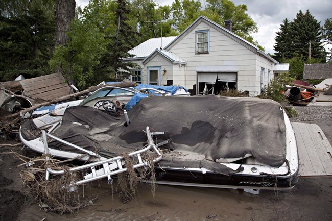 Wreckage lies along Center St. in High River, Alberta on Tuesday, June 25, 2013.