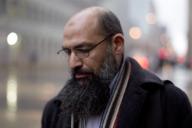 Mohamed Mahjoub stands outside a federal court in Toronto on December 15, 2011. 