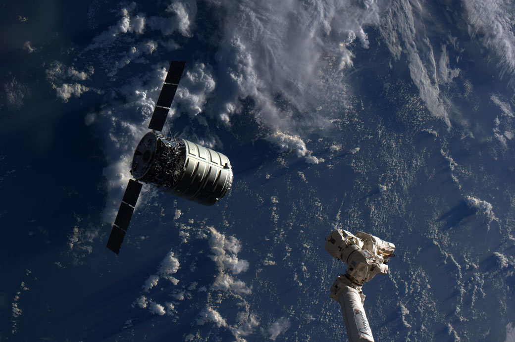 The Cygnus cargo spacecraft is just a few feet away from the International Space Station's Canadarm2.