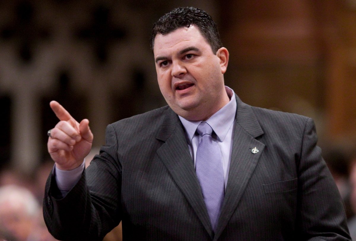 Conservative MP Dean Del Mastro rises during Question Period in the House of Commons on Parliament Hill in Ottawa, Thursday March 1, 2012. Del Mastro, who represents the riding of Peterborough, has been charged with four counts of violating the Canada Elections Act in connection with his 2008 campaign expenses. THE CANADIAN PRESS/Adrian Wyld.