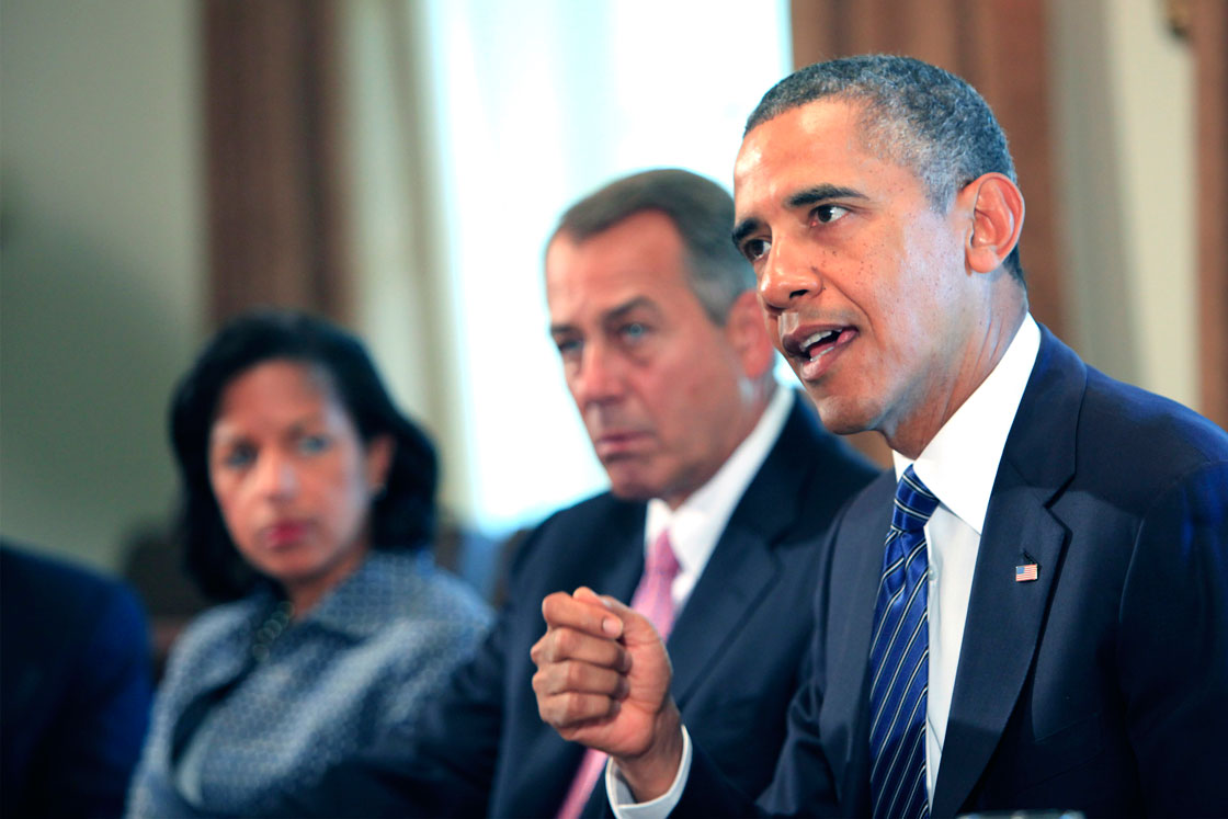 President Obama addresses the press as Republican House Speaker John Boehner looks on.