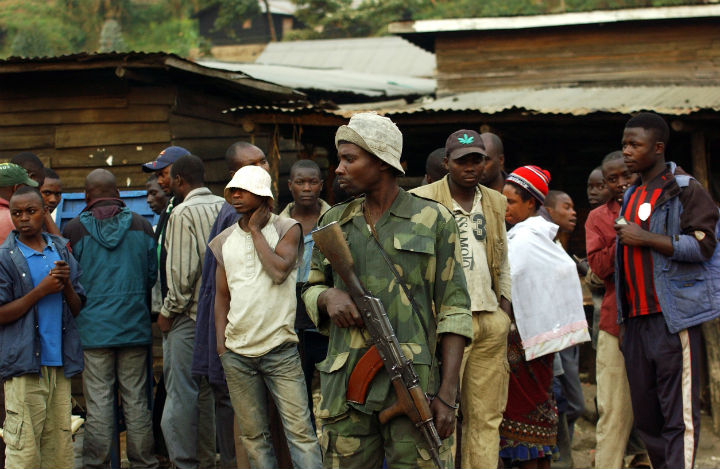A M23 soldier stands guard in the village of Kimbuba, in a M23 rebel-held territory, in the Democratic Republic of Congo on July 25, 2013.
