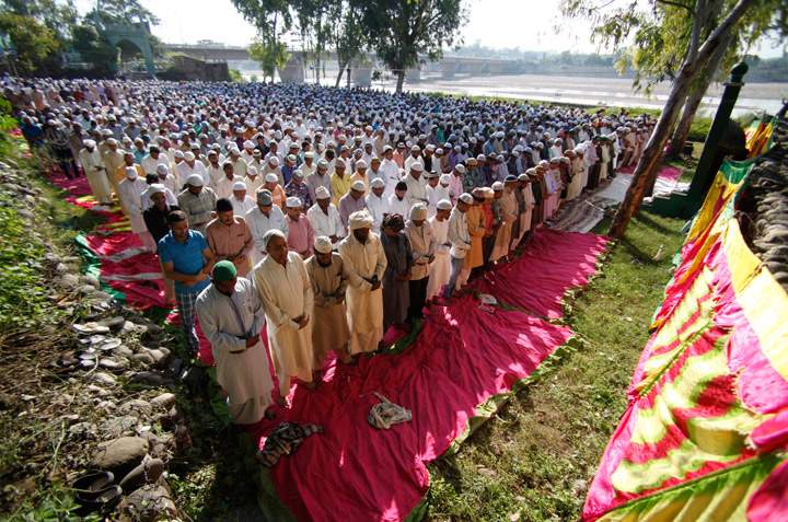 Indian Muslim men offer prayers during Eid al-Adha, or the Feast of the Sacrifice, in Jammu, India, Wednesday, Oct. 16, 2013. (Photo credit: AP Photo)