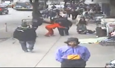 Screen capture of a surveillance video where a woman with cerebral palsy was shoved to the ground by Vancouver Police officer.